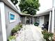 Private backyard featuring lush plants, a paved patio and a grill at 3110 W Haya St, Tampa, FL 33614