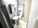 Efficient bathroom design with a pedestal sink and ample storage space, maximizing utility at 3110 W Haya St, Tampa, FL 33614