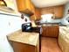 Efficient kitchen with ample cabinetry, a stove and tiled flooring at 3110 W Haya St, Tampa, FL 33614