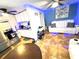 An open-concept living room with white furniture and a tiled floor, blending comfort and modern design at 3110 W Haya St, Tampa, FL 33614