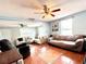Spacious living room featuring tile flooring, ceiling fans and natural light at 3110 W Haya St, Tampa, FL 33614