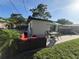 Relaxing backyard oasis featuring a hot tub and outdoor seating at 3120 Meadow Lake Ave, Largo, FL 33771