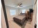 This is a bedroom with modern features, light-colored flooring, and a ceiling fan at 3120 Meadow Lake Ave, Largo, FL 33771