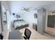 Comfortable bedroom with neutral tones, a ceiling fan, and a dedicated workspace at 3120 Meadow Lake Ave, Largo, FL 33771
