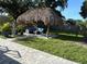 Tropical-inspired tiki hut, perfect for outdoor lounging and entertaining at 3120 Meadow Lake Ave, Largo, FL 33771
