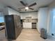 Modern kitchen featuring stainless steel appliances and sleek, white cabinetry at 3120 Meadow Lake Ave, Largo, FL 33771
