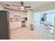 Bright kitchen with white cabinets, stainless steel appliances, and adjacent dining area at 3120 Meadow Lake Ave, Largo, FL 33771