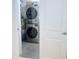 Convenient laundry room with stacked washer and dryer units at 3120 Meadow Lake Ave, Largo, FL 33771