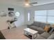 Comfortable living room with a grey sectional and modern decor elements at 3120 Meadow Lake Ave, Largo, FL 33771