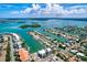 Breathtaking aerial view of a waterfront community with lush greenery and numerous docks at 324 Capri Blvd, Treasure Island, FL 33706