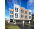 Contemporary three-story home featuring a modern design, multi-car garage, and stylish curb appeal at 324 Capri Blvd, Treasure Island, FL 33706