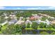 An elevated perspective showcases the home's peaceful setting within a lush, established community by a lake at 3409 61St E Ter, Ellenton, FL 34222