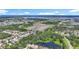 This aerial view showcases the neighborhood's serene setting with ponds, lakes, and lush landscapes at 3409 61St E Ter, Ellenton, FL 34222