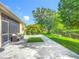 Expansive backyard with a patio overlooking a tranquil pond, ideal for relaxation at 3409 61St E Ter, Ellenton, FL 34222