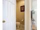 Half bathroom with toilet and tile floor adjacent to the shower at 3409 61St E Ter, Ellenton, FL 34222