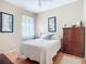 Bright bedroom with a comfortable bed, hardwood flooring, and modern decor at 3409 61St E Ter, Ellenton, FL 34222