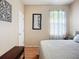 Well-lit bedroom featuring hardwood floors, neutral walls, and modern decor at 3409 61St E Ter, Ellenton, FL 34222
