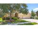 Attractive home with manicured lawn, vibrant flowers, mature shade tree, and a spacious two-car garage at 3409 61St E Ter, Ellenton, FL 34222