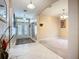 Foyer with white tile flooring, neutral colored walls, and a white framed glass panel entry door at 3409 61St E Ter, Ellenton, FL 34222