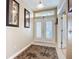 Inviting home entryway featuring double doors, tile flooring, and stylish decorative accents at 3409 61St E Ter, Ellenton, FL 34222