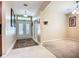 Bright foyer with tiled flooring, high ceilings, and a view of the open living area at 3409 61St E Ter, Ellenton, FL 34222