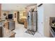Open-concept kitchen featuring stainless steel appliances and wooden cabinets at 3409 61St E Ter, Ellenton, FL 34222
