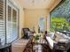 Inviting lanai with sliding door access and shaded seating; perfect for outdoor relaxation at 3409 61St E Ter, Ellenton, FL 34222