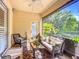 Relaxing screened lanai with comfortable seating, ceiling fan, and peaceful views at 3409 61St E Ter, Ellenton, FL 34222