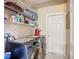 Functional laundry room featuring a modern washer and dryer and ample shelving space at 3409 61St E Ter, Ellenton, FL 34222