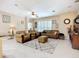 Spacious living room with tile flooring, ceiling fan, and comfortable seating arrangement at 3409 61St E Ter, Ellenton, FL 34222