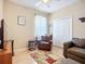 Cozy living room with hardwood flooring, comfortable seating, and neutral colored walls at 3409 61St E Ter, Ellenton, FL 34222