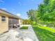 The patio offers outdoor enjoyment with a view of the lush backyard and pond at 3409 61St E Ter, Ellenton, FL 34222