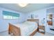 Cozy bedroom featuring a comfortable bed and classic decor at 35014 Carl Ave, Zephyrhills, FL 33541