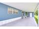 Spacious carport adjacent to a delightful home, blending functionality with charm at 35014 Carl Ave, Zephyrhills, FL 33541