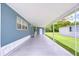 Extended carport offering shade and ample space, attached to a cozy home at 35014 Carl Ave, Zephyrhills, FL 33541