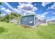 Exterior view featuring a well-maintained home with a satellite dish and a green lawn at 35014 Carl Ave, Zephyrhills, FL 33541