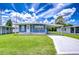 Charming single story home with well-maintained lawn and covered parking at 35014 Carl Ave, Zephyrhills, FL 33541