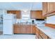 Classic kitchen with stainless steel sink and wood cabinets at 35014 Carl Ave, Zephyrhills, FL 33541