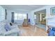 Bright living room with large windows and hardwood floors at 35014 Carl Ave, Zephyrhills, FL 33541