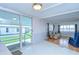 Bright living room and patio access via sliding glass doors at 35014 Carl Ave, Zephyrhills, FL 33541