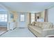 Cozy living room with comfortable furnishings and bright natural light at 35014 Carl Ave, Zephyrhills, FL 33541