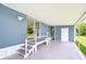 Spacious side porch with outdoor access, perfect for relaxation at 35014 Carl Ave, Zephyrhills, FL 33541