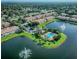 Aerial view of a community with a pool, lakes, fountains and manicured landscaping at 3641 Parkridge Cir # 10-103, Sarasota, FL 34243