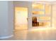 Spacious open-concept living room with tile flooring and a decorative wall feature at 3641 Parkridge Cir # 10-103, Sarasota, FL 34243
