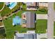 Aerial view of home with lush backyard featuring a sparkling pool, perfect for luxurious outdoor living at 380 Colony Point S Rd, St Petersburg, FL 33705