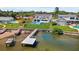 Aerial view of waterfront home with a pool and dock at 380 Colony Point S Rd, St Petersburg, FL 33705
