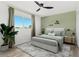 Staged bedroom with soft lighting, stylish decor and wood-look flooring at 380 Colony Point S Rd, St Petersburg, FL 33705
