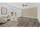 Light-filled bedroom featuring a ceiling fan and access to a balcony at 380 Colony Point S Rd, St Petersburg, FL 33705