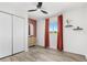 Clean bedroom with hardwood floors, closet, large window with nice view and ceiling fan at 380 Colony Point S Rd, St Petersburg, FL 33705