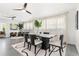 Elegant dining area featuring modern furnishings, ample natural light, and stylish decor, perfect for gatherings and meals at 380 Colony Point S Rd, St Petersburg, FL 33705